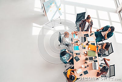 Multiethnic diverse group of business coworkers in team meeting discussion, top view modern office with copy space Stock Photo