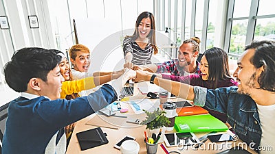 Multiethnic diverse group of office coworker, business partner fist bump in modern office. Colleague partnership teamwork concept Stock Photo