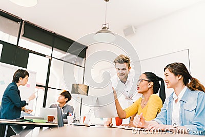 Multiethnic diverse group of people at work. Creative team, casual business coworker, or college students in brainstorm meeting Stock Photo