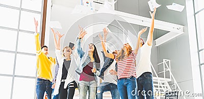 Multiethnic diverse happy team celebrate project success throw paper up together. Corporate community, or small business concept Stock Photo