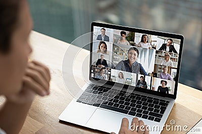 Multiethnic employees talk on video zoom call Stock Photo