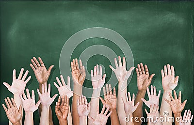 Multiethnic Group of Hands Raised with Blackboard Stock Photo