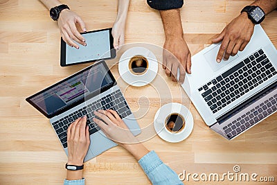 Multiethnic group of young people using laptops and drinking coffee Stock Photo