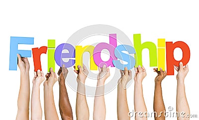 Multiethnic People Holding The Word Friendship Stock Photo