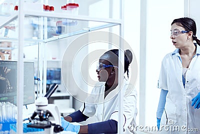 Multiethnic scientific team working together Stock Photo