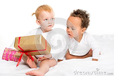 multiethnic toddlers with wrapped gifts Stock Photo