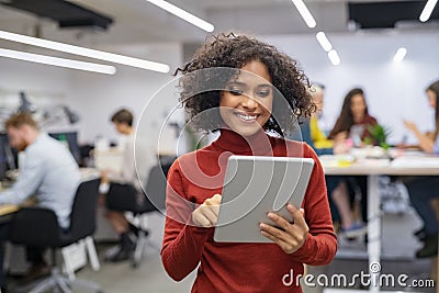 Multiethnic young businesswoman using digital tablet Stock Photo