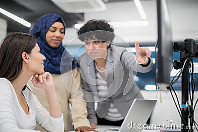 Multiethnics team of software developers working together Stock Photo