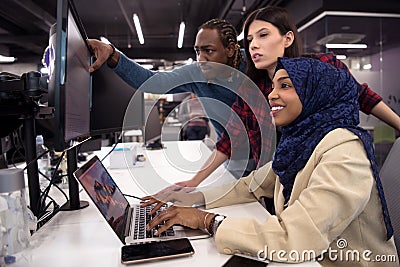 Multiethnics team of software developers working together Stock Photo