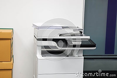 Multifunctional office laser printer for use in scanning and printing business documents in workplace Stock Photo