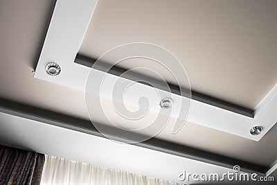 Multilevel suspended and suspended ceiling of plasterboard Stock Photo