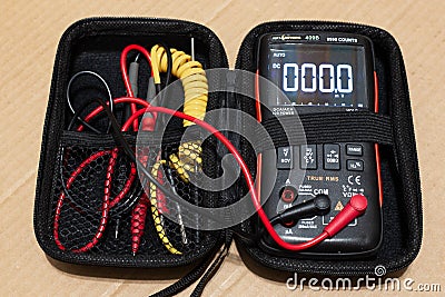 Multimeter is an electronic device for measuring current, voltage, electrical resistance, temperature, for checking Editorial Stock Photo