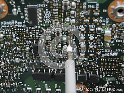 Multimeter probes examining a circuit board Stock Photo