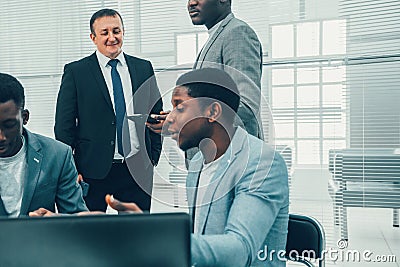 Multinational business team works in the office. Stock Photo