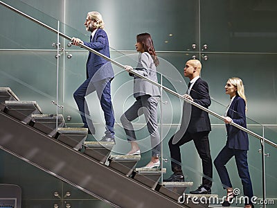 Multinational and multiethnic corporate business people walking Stock Photo