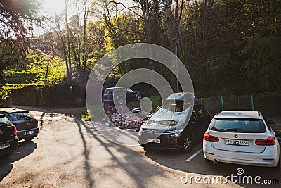 Multiple cars from France, Belgium and Switzerland in French parking Editorial Stock Photo