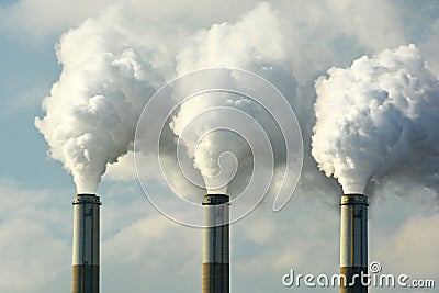 Multiple Coal Fossil Fuel Power Plant Smokestacks Emit Carbon Dioxide Pollution Stock Photo