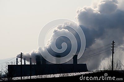 Multiple coal fossil fuel power plant smokestacks emit carbon dioxide pollution. Stock Photo