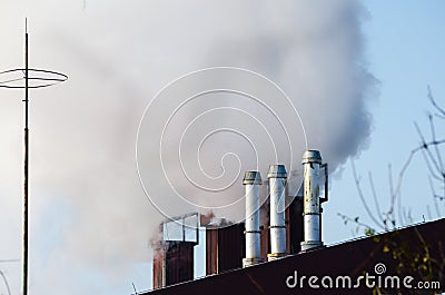 Multiple coal fossil fuel power plant smokestacks emit carbon dioxide pollution. Stock Photo