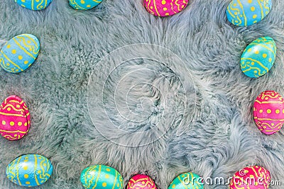 Chocolate Easter eggs on fur, pink, blue and green eggs, easter backgroung Stock Photo