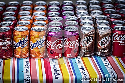 Multiple colorful sodas on an outdoor tablecloth Editorial Stock Photo