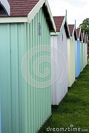 Colourful wooden huts on a beach Stock Photo