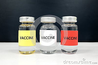 Multiple colors vaccine vials. Coronavirus covid-19 vaccine candidate concept. Stock Photo