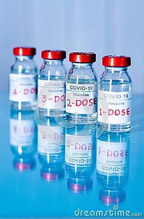 Multiple doses of covid-19 or coronavirus vaccines on table for vaccination to protect againt coronavirus mutated variants or to Stock Photo