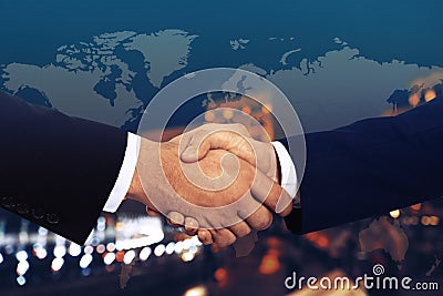 Multiple exposure of partners shaking hands, world map and city. Business values Stock Photo