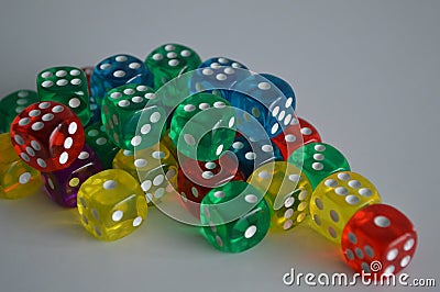 Multiple green yellow purple blue red plastic arcylic d6 six sided die dice variable focus Stock Photo