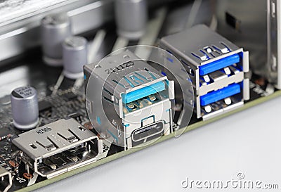 Multiple ports on modern computer mainboard show with Display port, USB 3.2 type A and type C, usb 3.1 Stock Photo