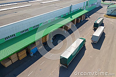 Multiple trucks loading at the factory top view Stock Photo