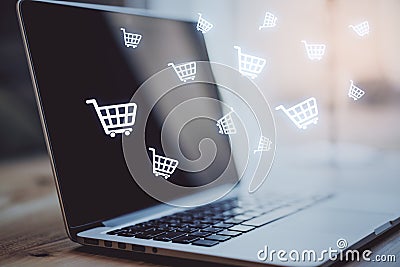 Multiple white shopping carts icons with a laptop in the background. Online shopping and purchase concept, 3d rendering Stock Photo