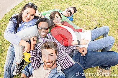 Multiracial best friends taking selfie at meadow picnic - Happy friendship fun concept with young people millenials having fun Stock Photo