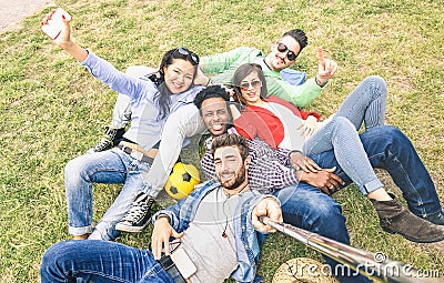 Multiracial best friends taking selfie at meadow picnic - Happy Stock Photo