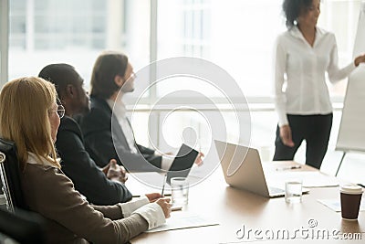 Multiracial businesspeople attending corporate group training or Stock Photo