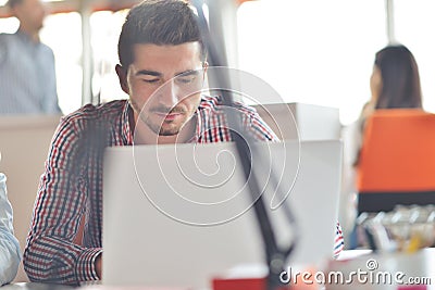 Multiracial contemporary business people working connected with technological devices like tablet and laptop Stock Photo