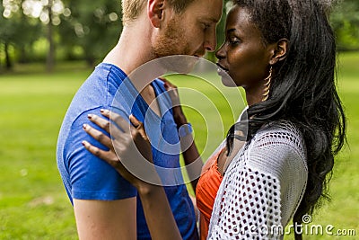 Multiracial couple in the park Stock Photo