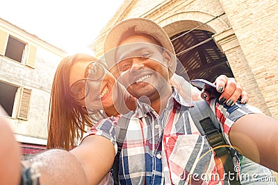 Multiracial couple taking selfie at old town trip travel Stock Photo