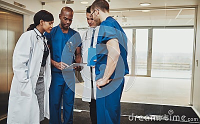 Multiracial team of doctors discussing a patient Stock Photo