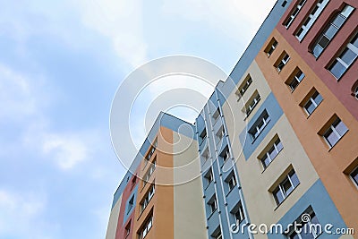 Multistorey apartment building against cloudy sky, low angle view Stock Photo