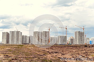 Multistorey building and big cranes Editorial Stock Photo