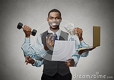 Multitasking happy business man on grey wall background Stock Photo
