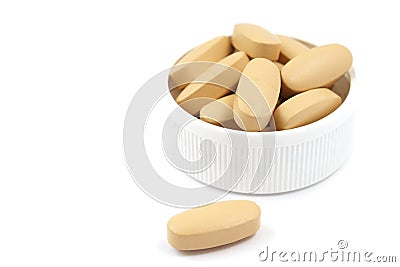 Multivitamin pills in the plastic cap Stock Photo