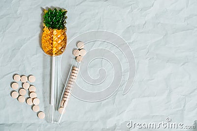 Multivitamins and supplements with fresh orange and lamon on white wooden background Stock Photo