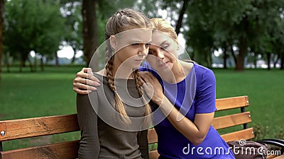 Mum calming daughter, disappointment after doctors visit, health problems Stock Photo
