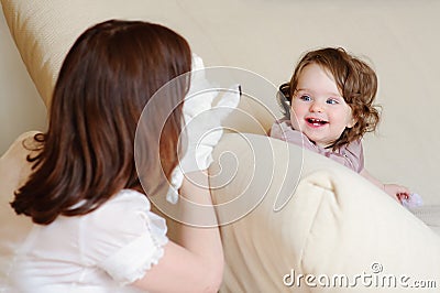 Mum and daughter play puppet show Stock Photo