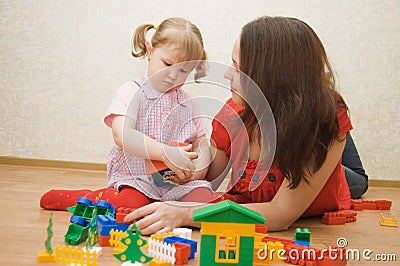 Mum and daughter play in room Stock Photo