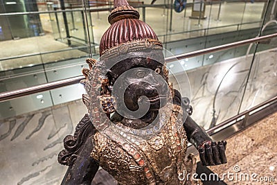 MUMBAI AIRPORT, INDIA JANUARY 02, 2019: Publicly exhibited antic wooden sculpture of Hanuman, known as the Lord of Celibacy, Editorial Stock Photo