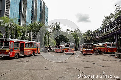 Mumbai,India August-25-2019: City`s public transport BEST buses stranded at a depot. The BEST public tranport company is sufferin Editorial Stock Photo